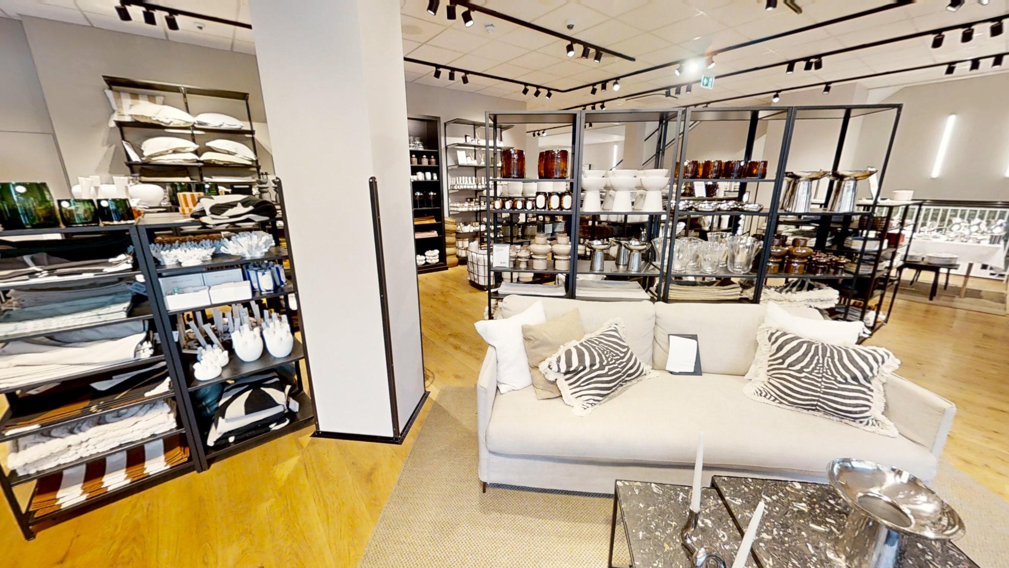 Sofa and homeware displays inside H&M Exeter