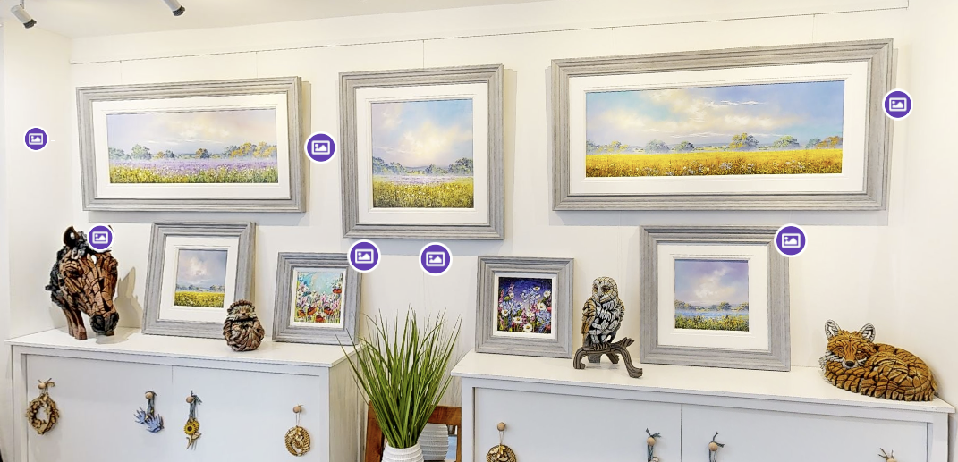 Framed landscape paintings and sculptures with interactive gallery information markers